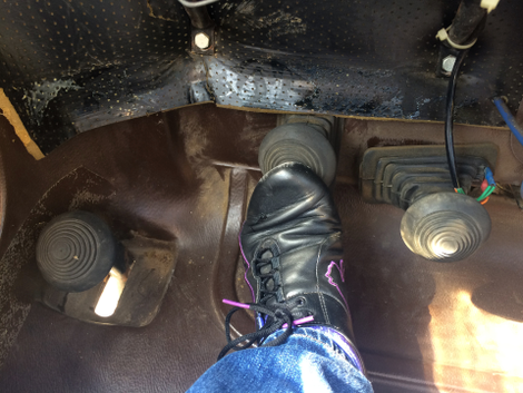 The pedals are more like buttons than pedals, and the button to the left moves the car 2 inches at a time. Photo credit: Stef Schrader